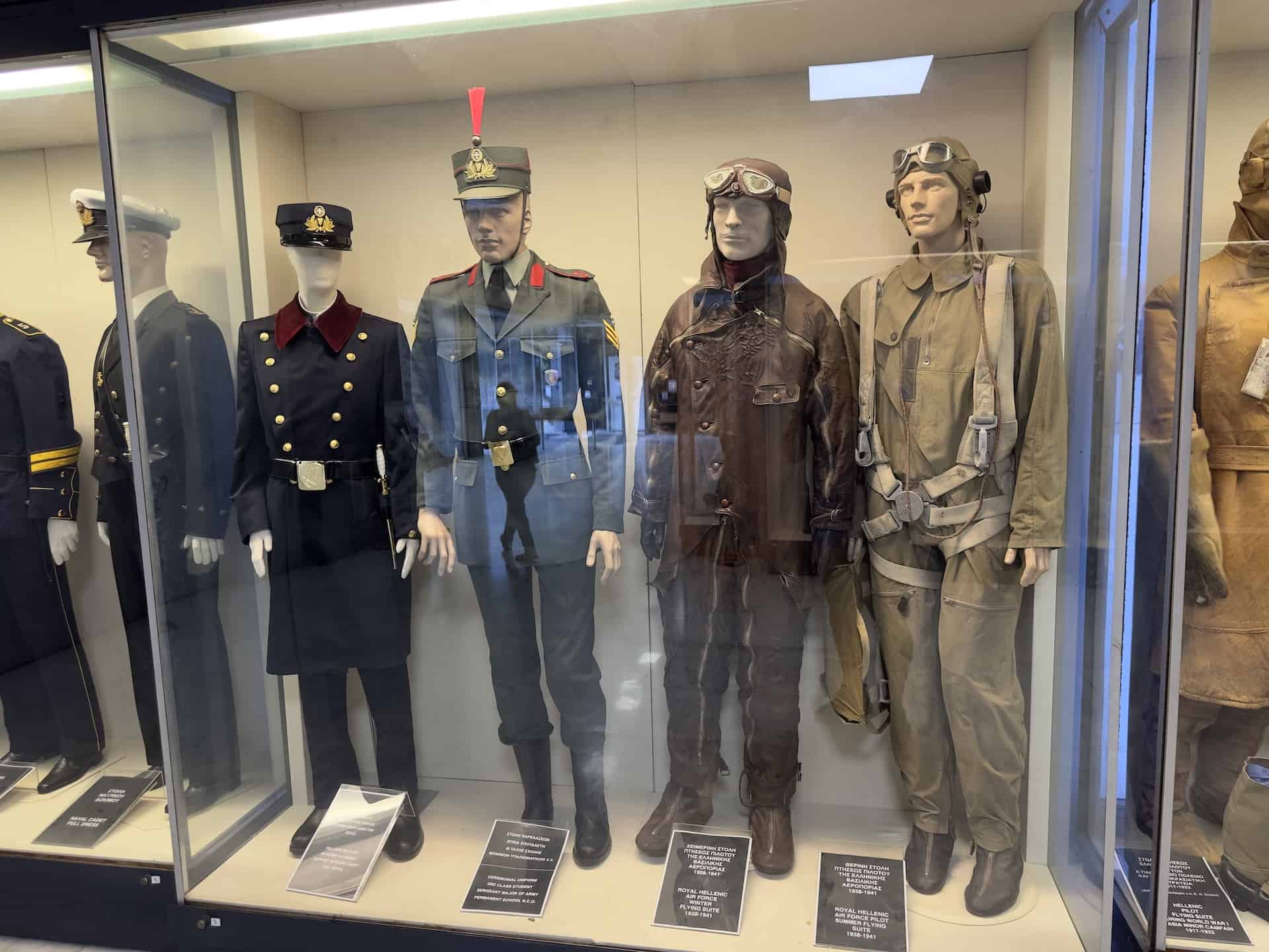 Hellenic Military Academy combat support officer's cadet full dress (left); Ceremonial uniform, 3rd class student seargent major of the army permanent school NCO (center left); Royal Hellenic Air Force winter flying suit, 1938-1941 (center right); Royal Hellenic Air Force summer flying suit, 1938-1941 (right) at the War Museum in Athens, Greece