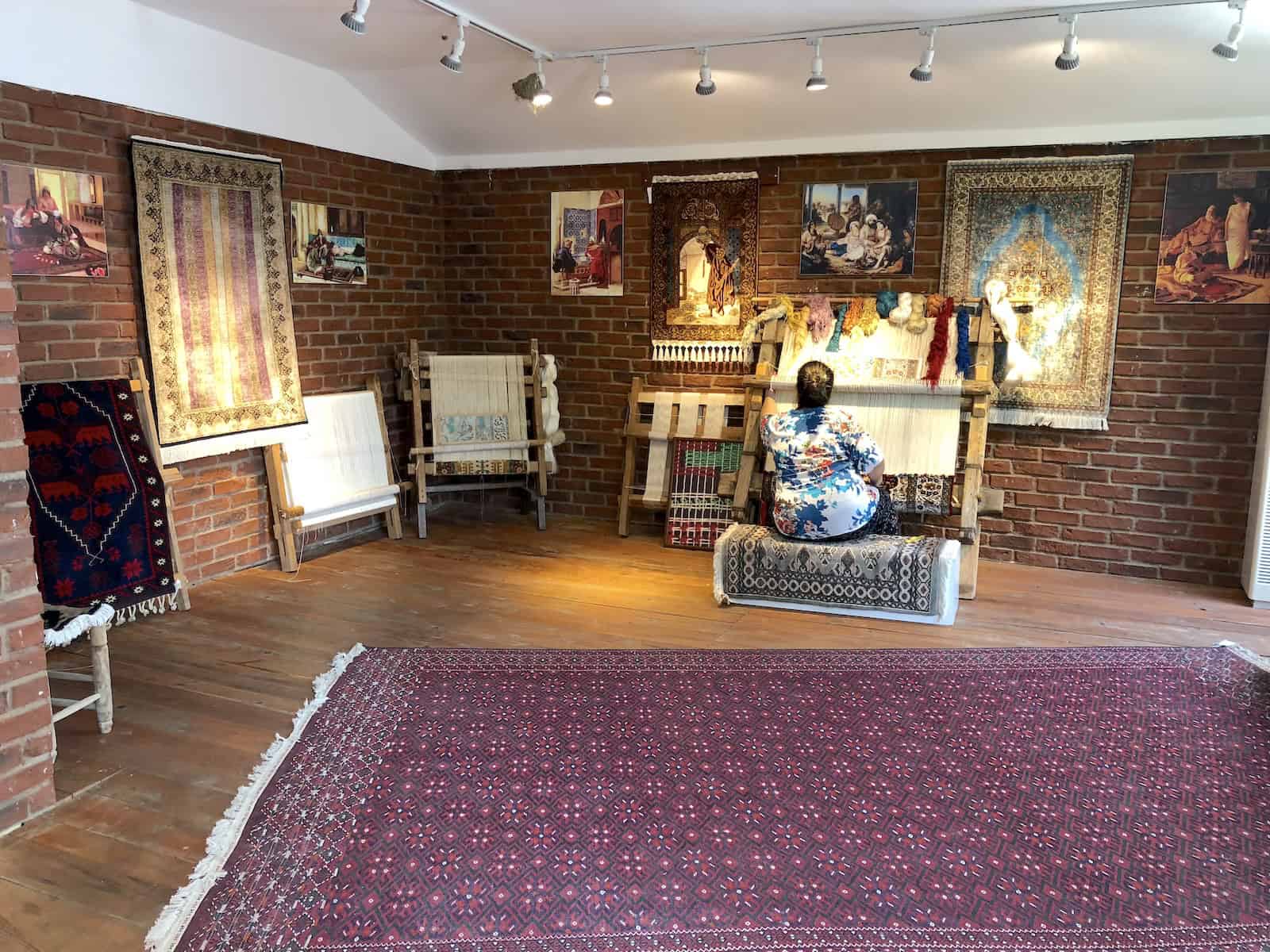 Weaving demonstration at Aladdin's Rug Warehouse in Selçuk, Turkey