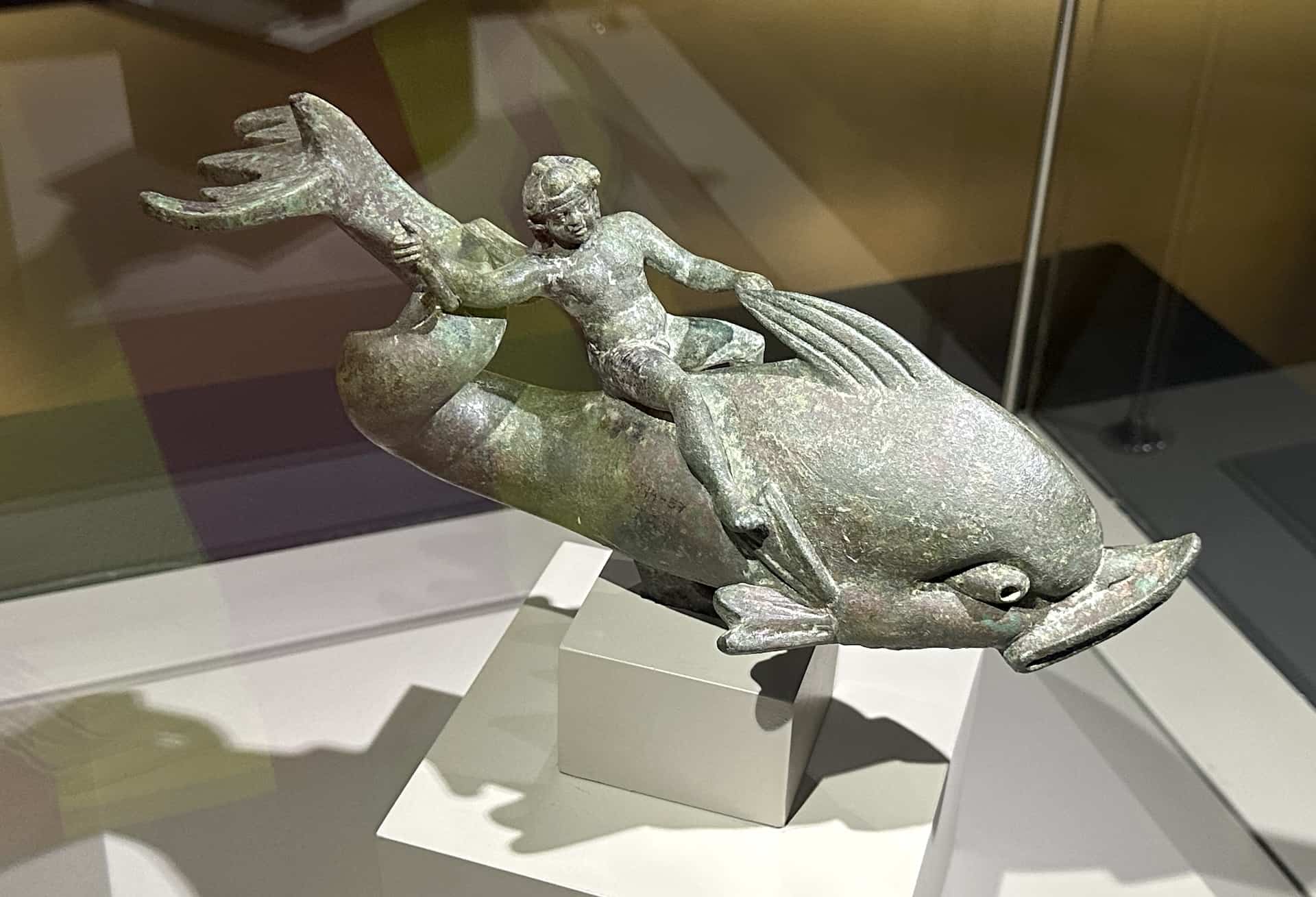 Eros riding a dolphin (Bronze, 2nd century BC) in the Hall of the Terrace House Findings at the Ephesus Museum in Selçuk, Turkey