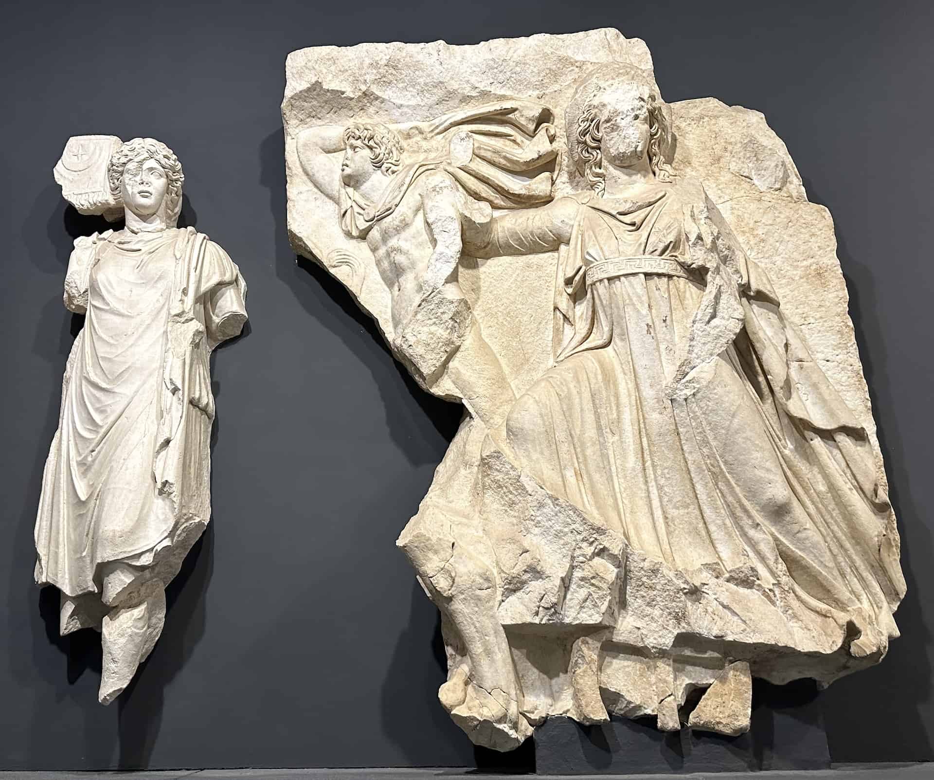 Female figure symbolizing the city of Currhae holding a vexillum (flag)(left) and Selene and Apollo Helios (right) from the Parthian Monument