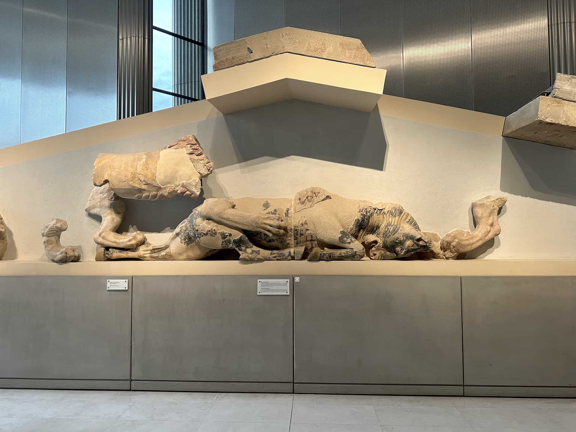 Two lions devouring a bull on the west pediment of the Hekatompedon