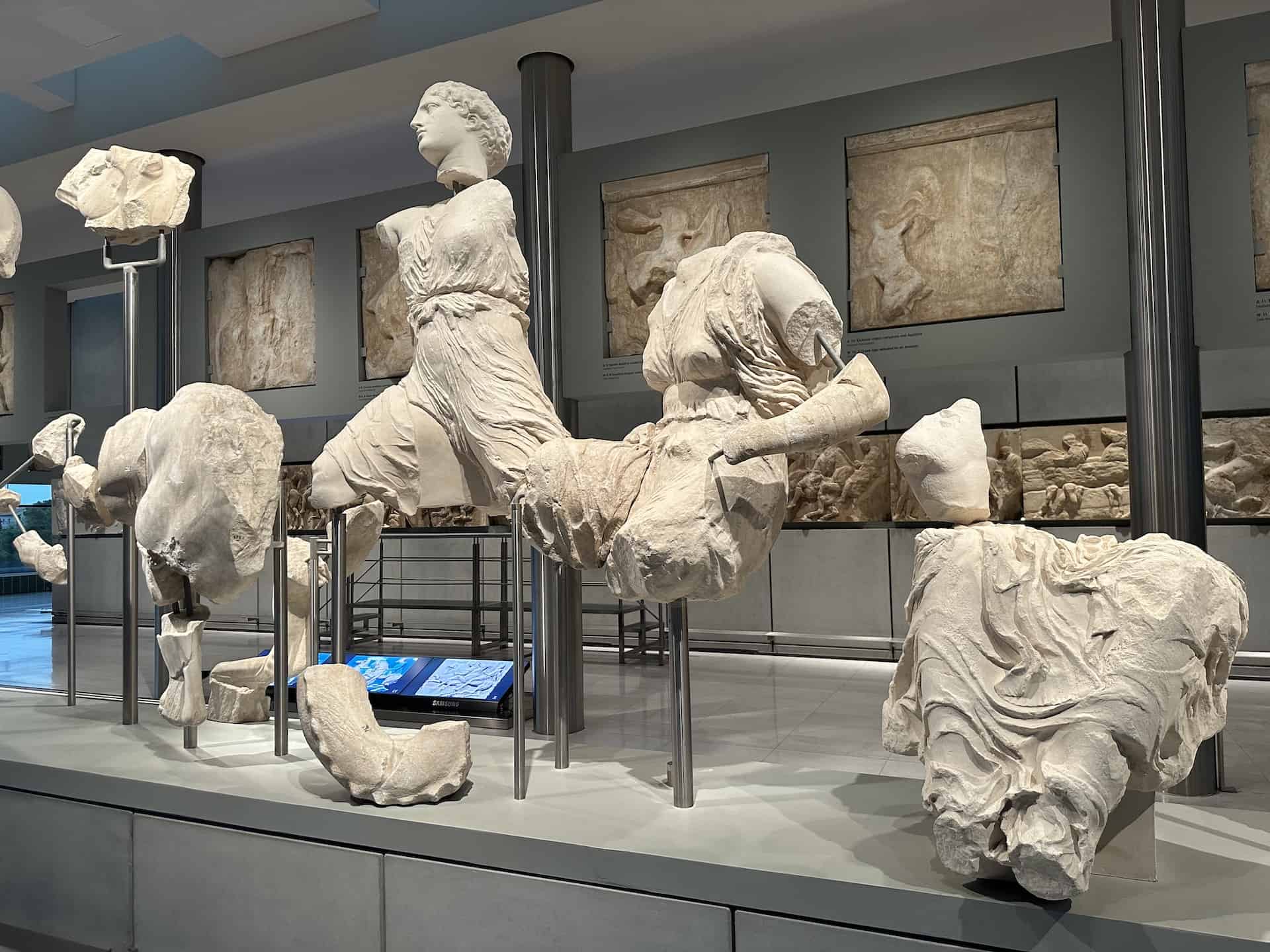 Iris (left), Amphitrite (center), Boy (upper right), and Heroine (Oreithyia) (lower right) on the west pediment of the Parthenon at the Acropolis Museum in Athens, Greece