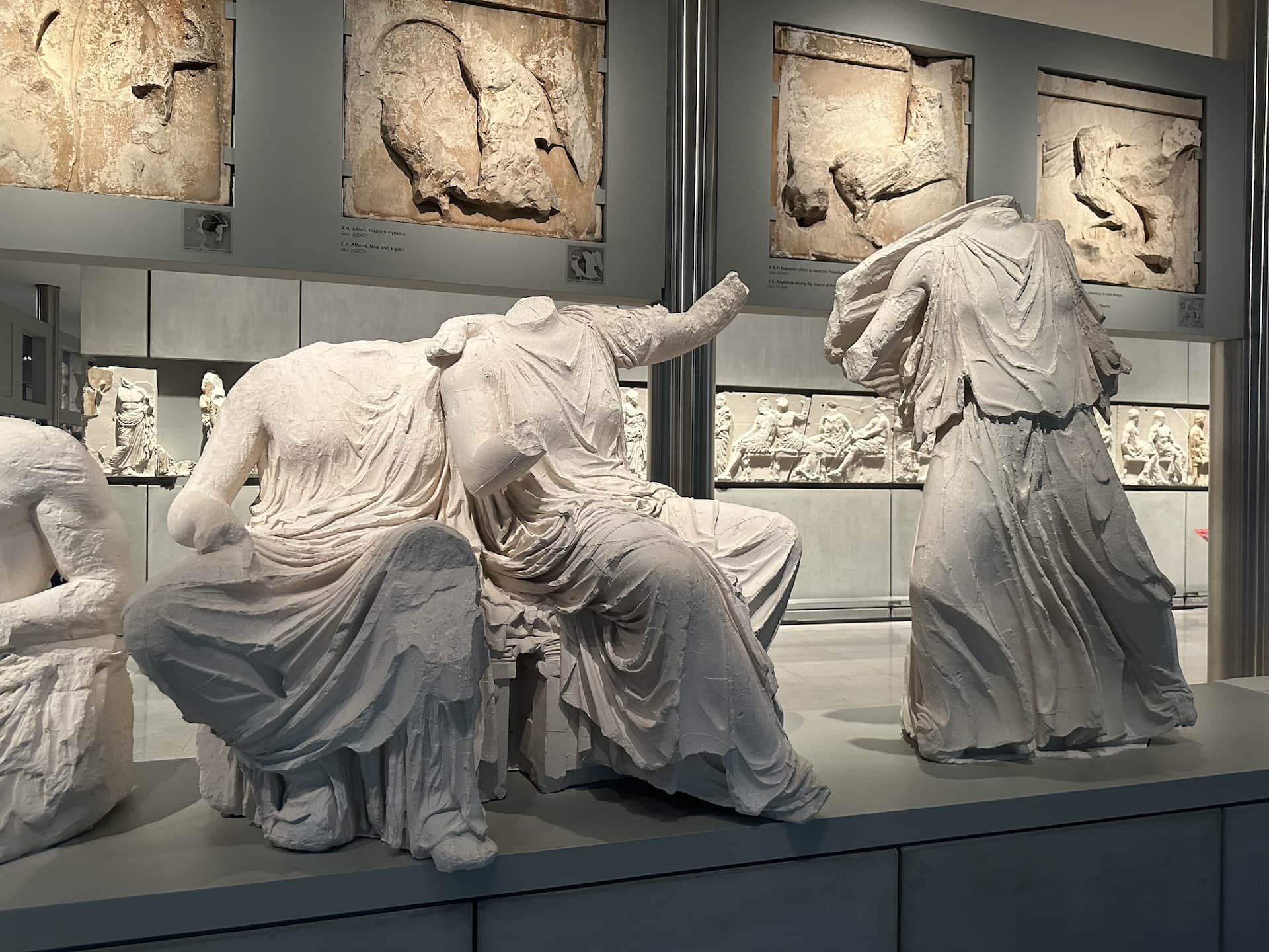 Kore (Persephone) and Demeter (left) and Artemis (right); all in the British Museum on the east pediment of the Parthenon at the Acropolis Museum in Athens, Greece