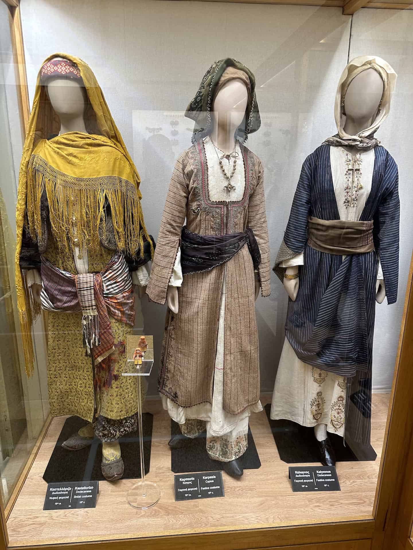 Bridal costume from Kastellorizo, 18th century (left); festive costume from Karpasia, Cyprus, 19th century (center); and festive costume from Kalymnos, 18th century (right) at the National Historical Museum in Athens, Greece