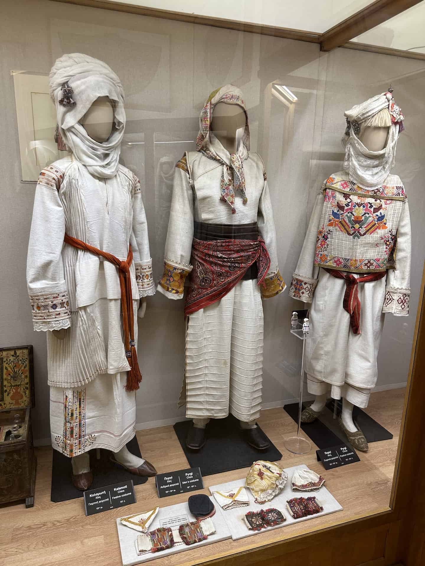 Festive costume from Kalamoti, Chios, 19th century (left); men's costume from Pyrgi, Chios, 18th-19th centuries (center); and festive costume from Pyrgi, Chios, 18th-19th centuries (right) at the National Historical Museum in Athens, Greece