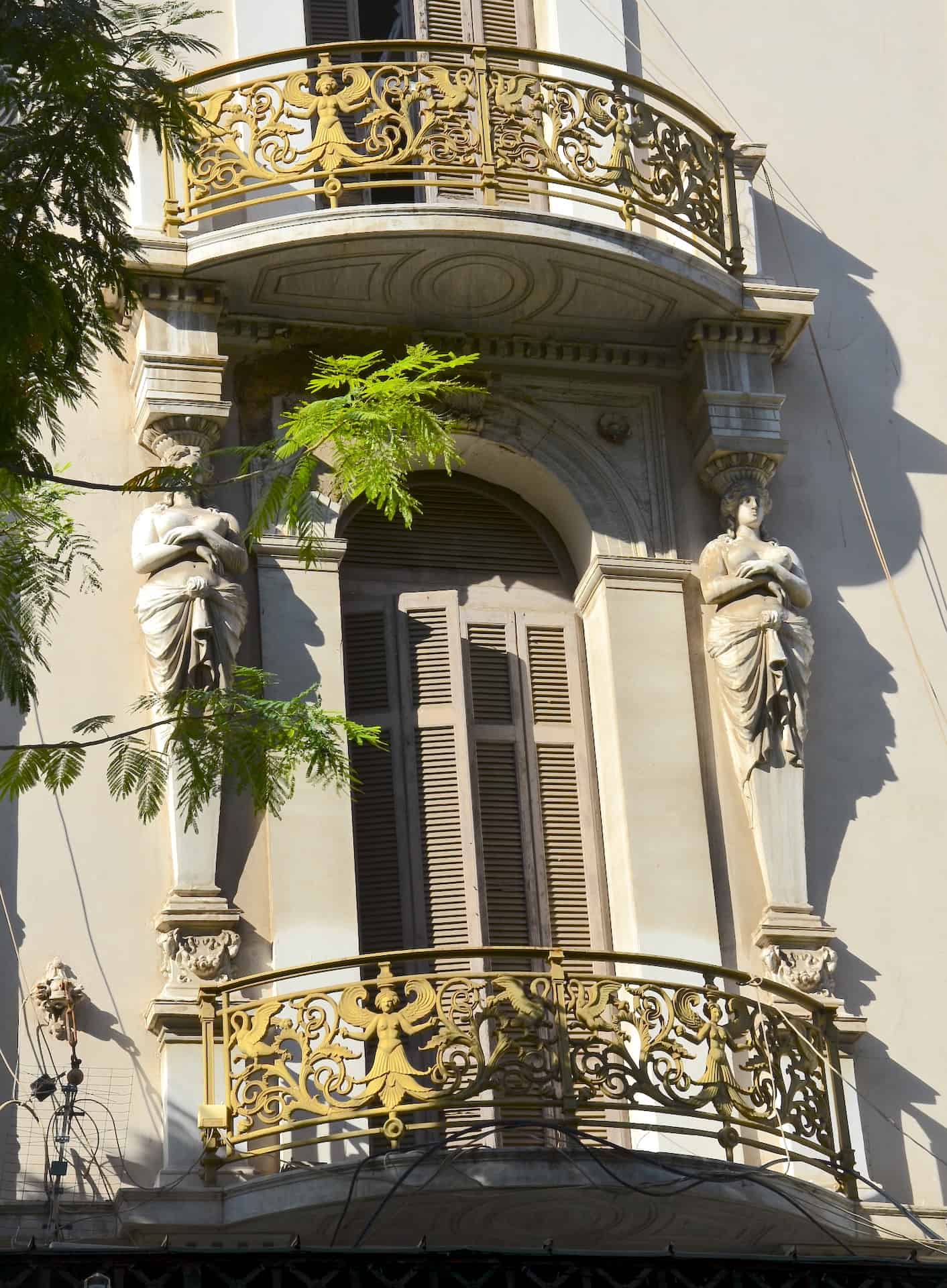 Caryatids and a balcony on the Megas Alexandros on Omonoia Square in the Historic Center of Athens, Greece