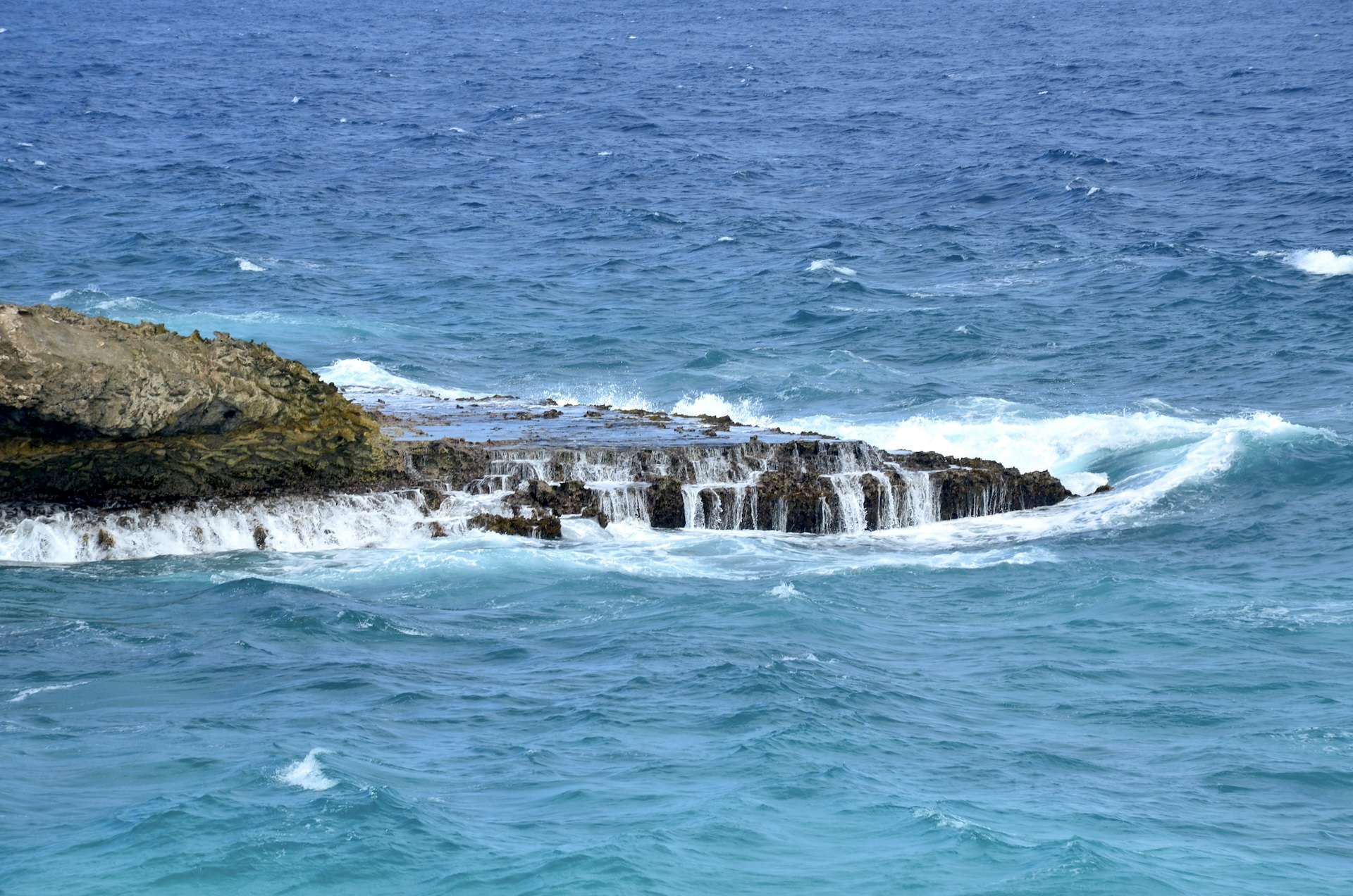 Waves crashing onto the rocks at Boca Prins