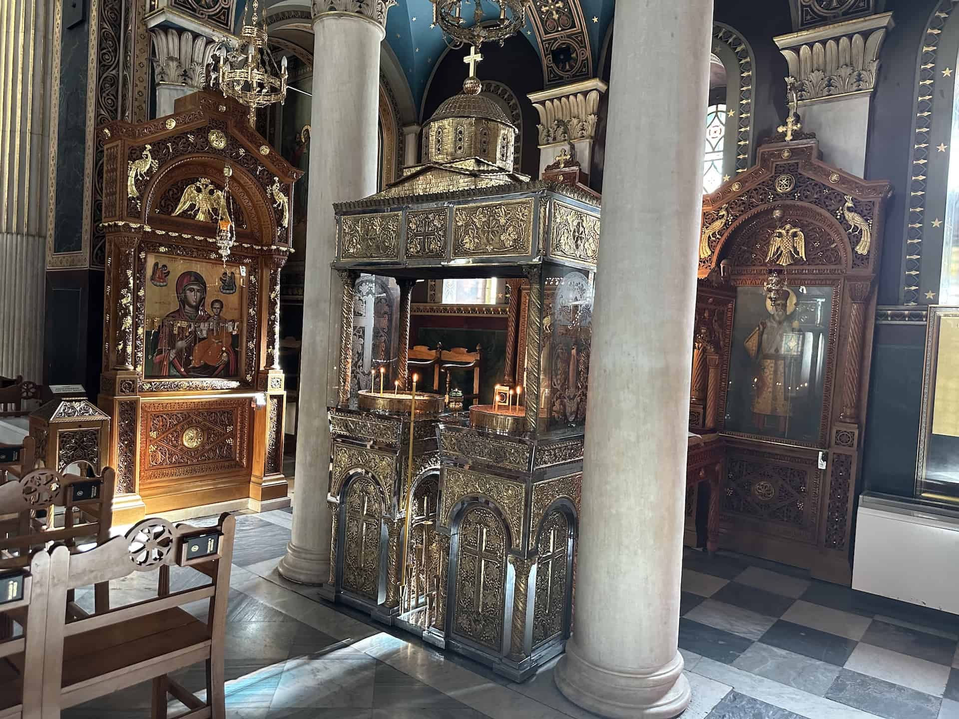 Icons and candle stand in Panagia Chrysospileotissa