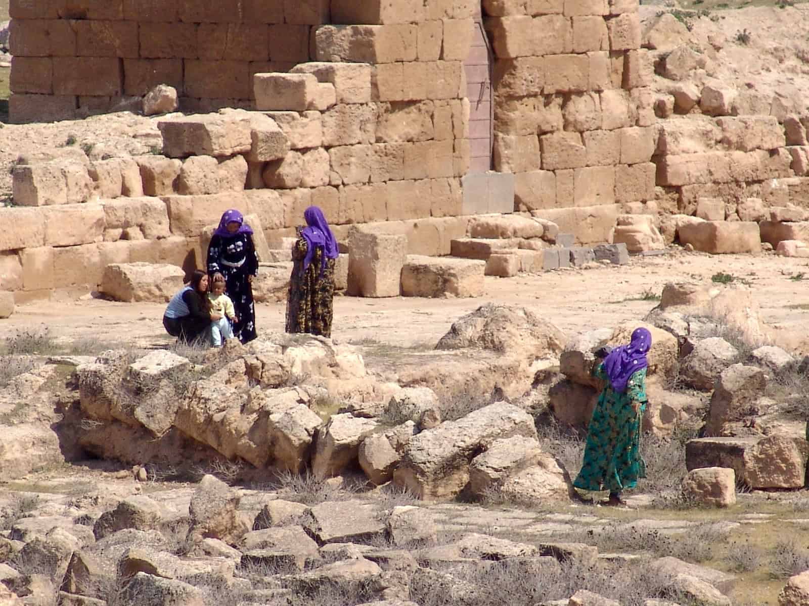 Locals at the ruins of the Grand Mosque