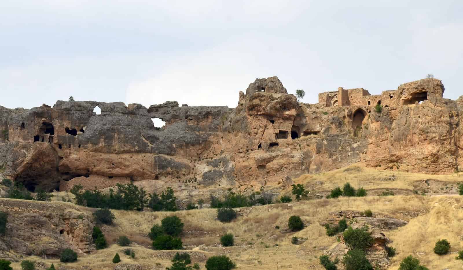 Ruins and caves on the cliffs near Mor Hananyo in the Tur Abdin, Turkey