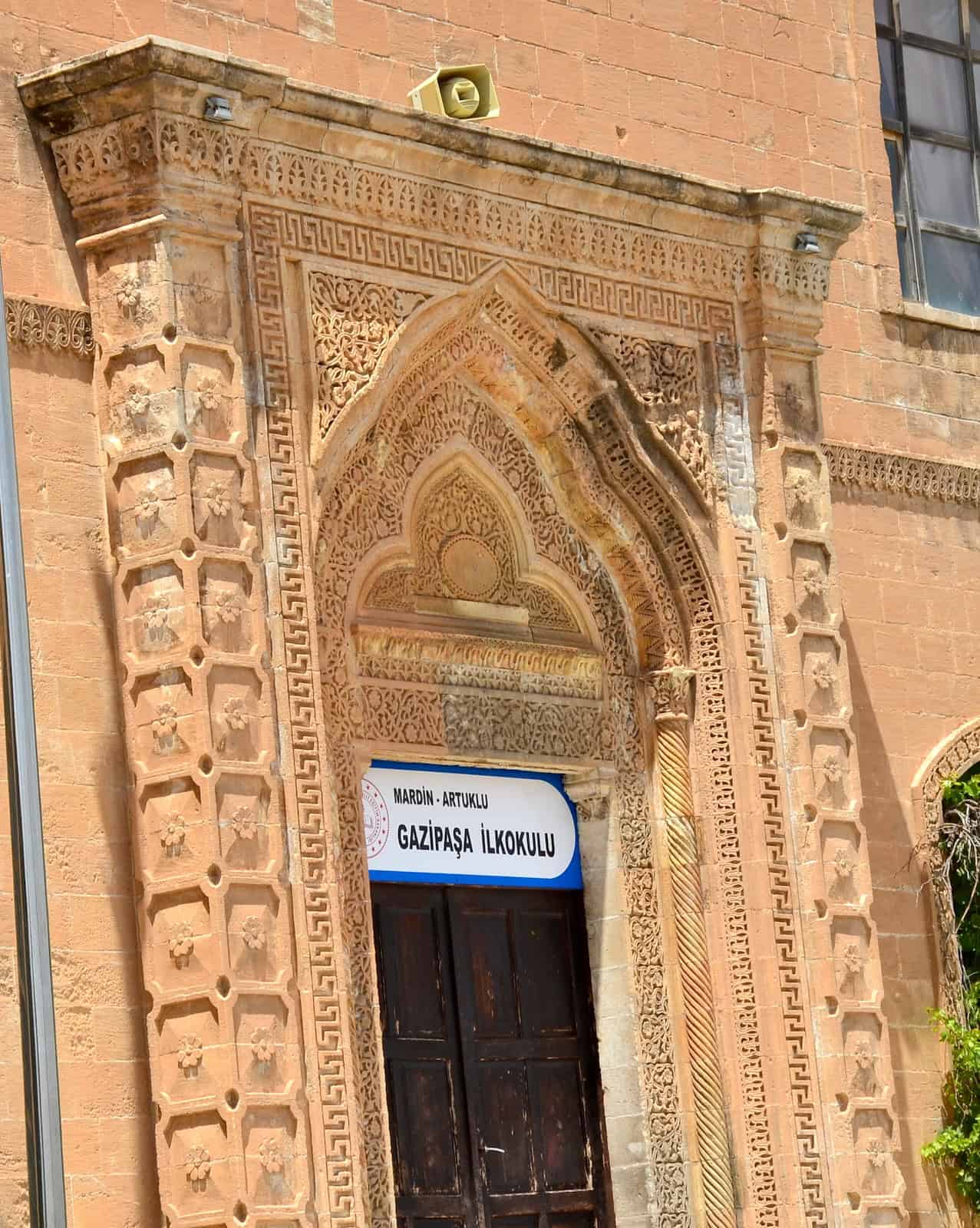 Monumental entrance of the east wing of the Mardin Girls Vocational School in Mardin, Turkey