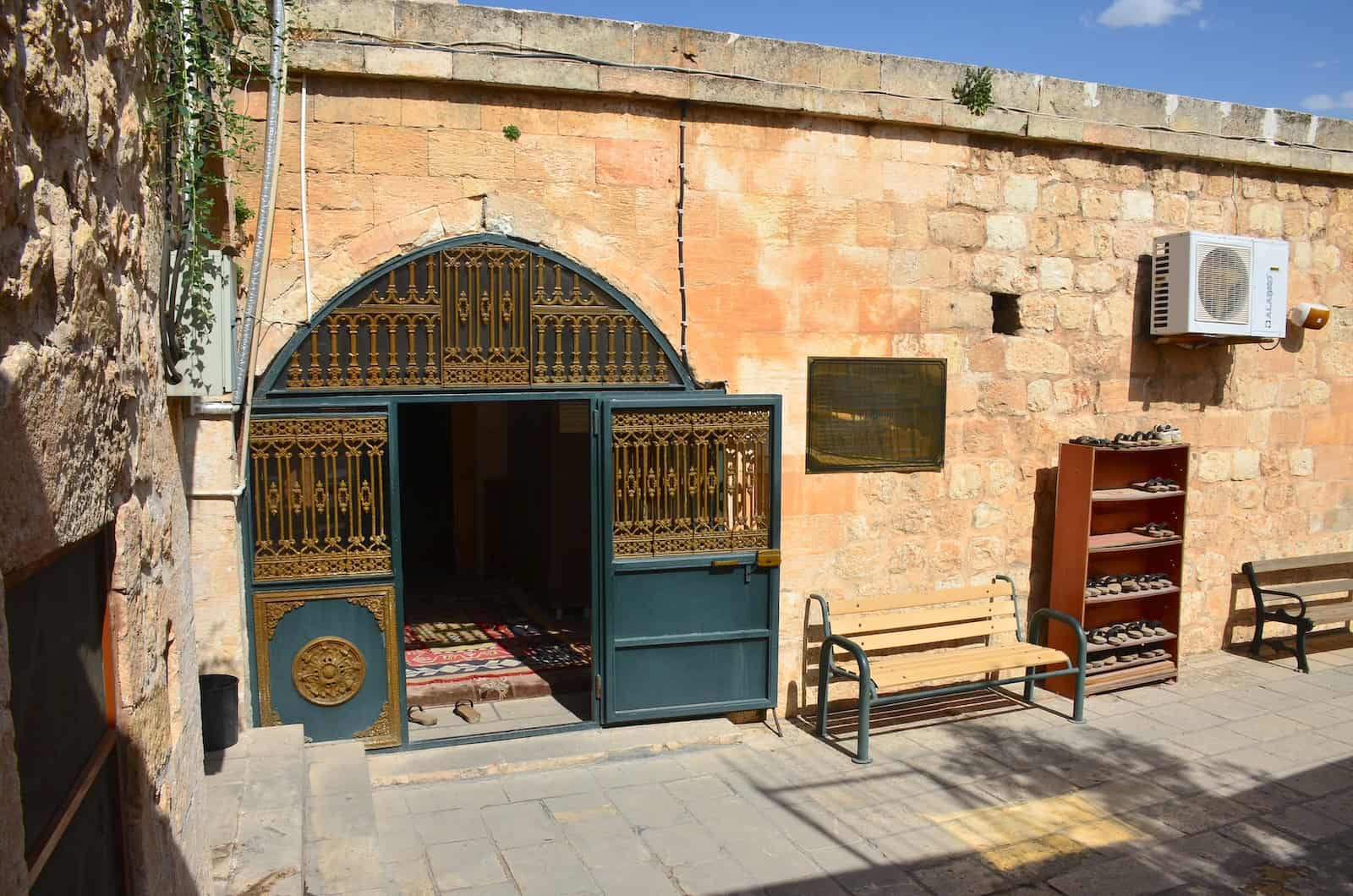 Courtyard and entrance portal of the Sheikh Çabuk Mosque in Mardin, Turkey