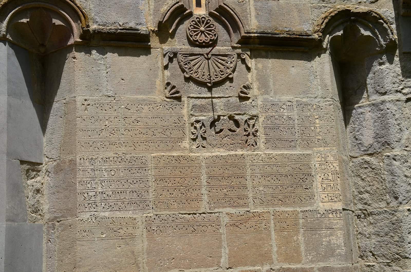 Inscriptions and sundial on the south façade of the Church of St. Stephen at Haghartsin Monastery