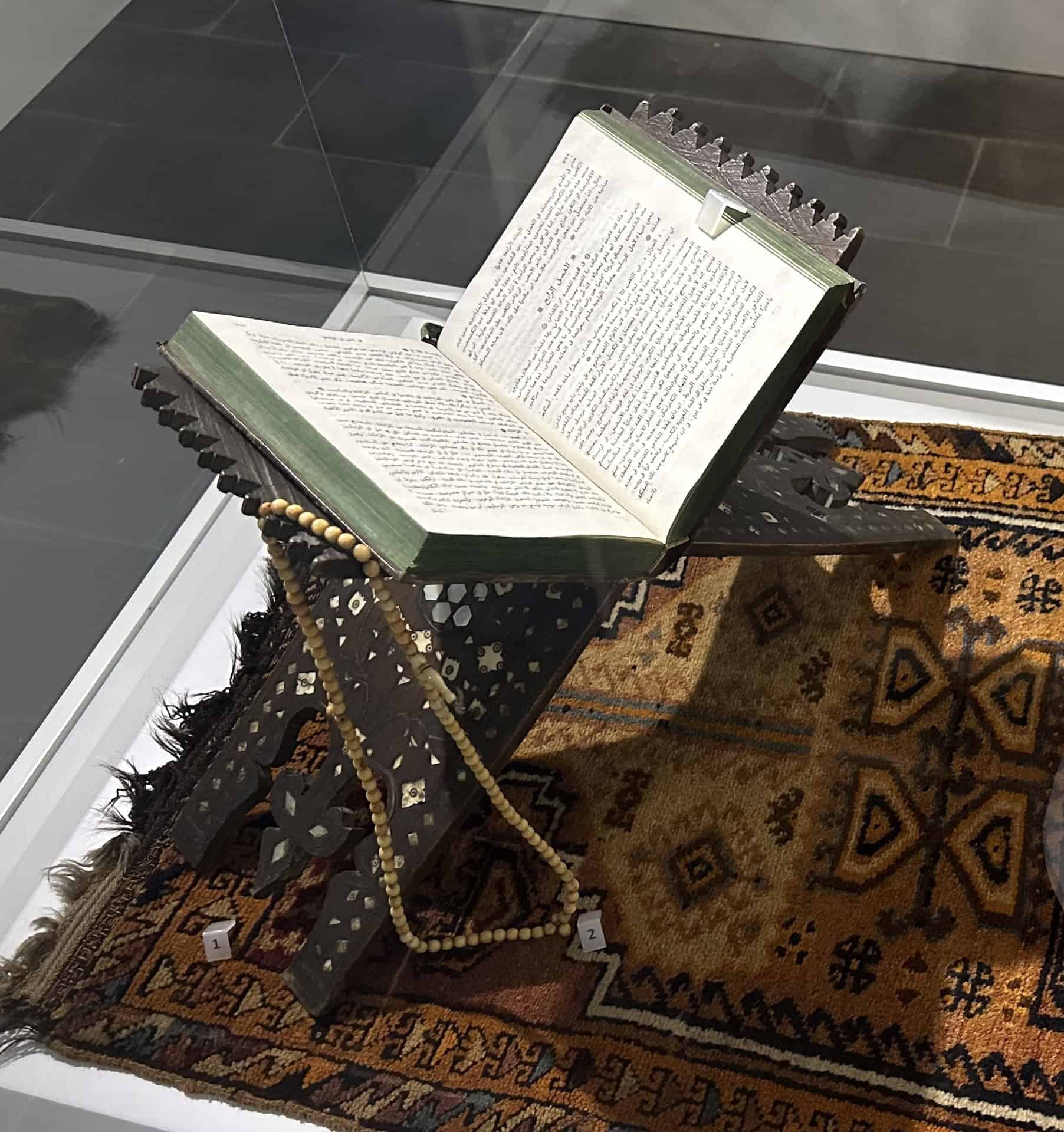 Quran stand, wood, 17th-18th century; and prayer bead, stone, 20th century in the Gendarmerie Building