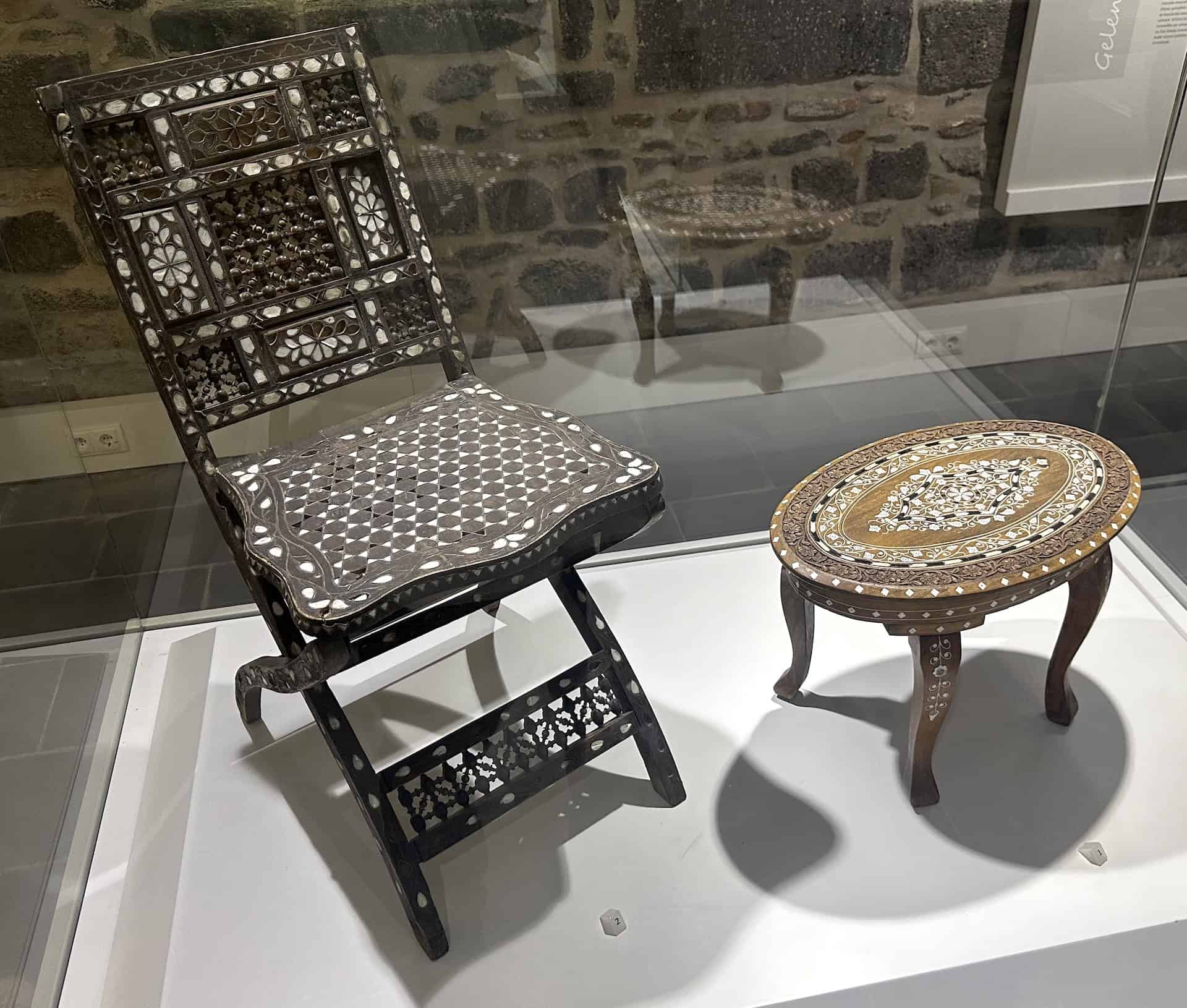 18th-19th century table and 17th-18th century chair, both with inlaid mother-of-pearl in the Gendarmerie Building