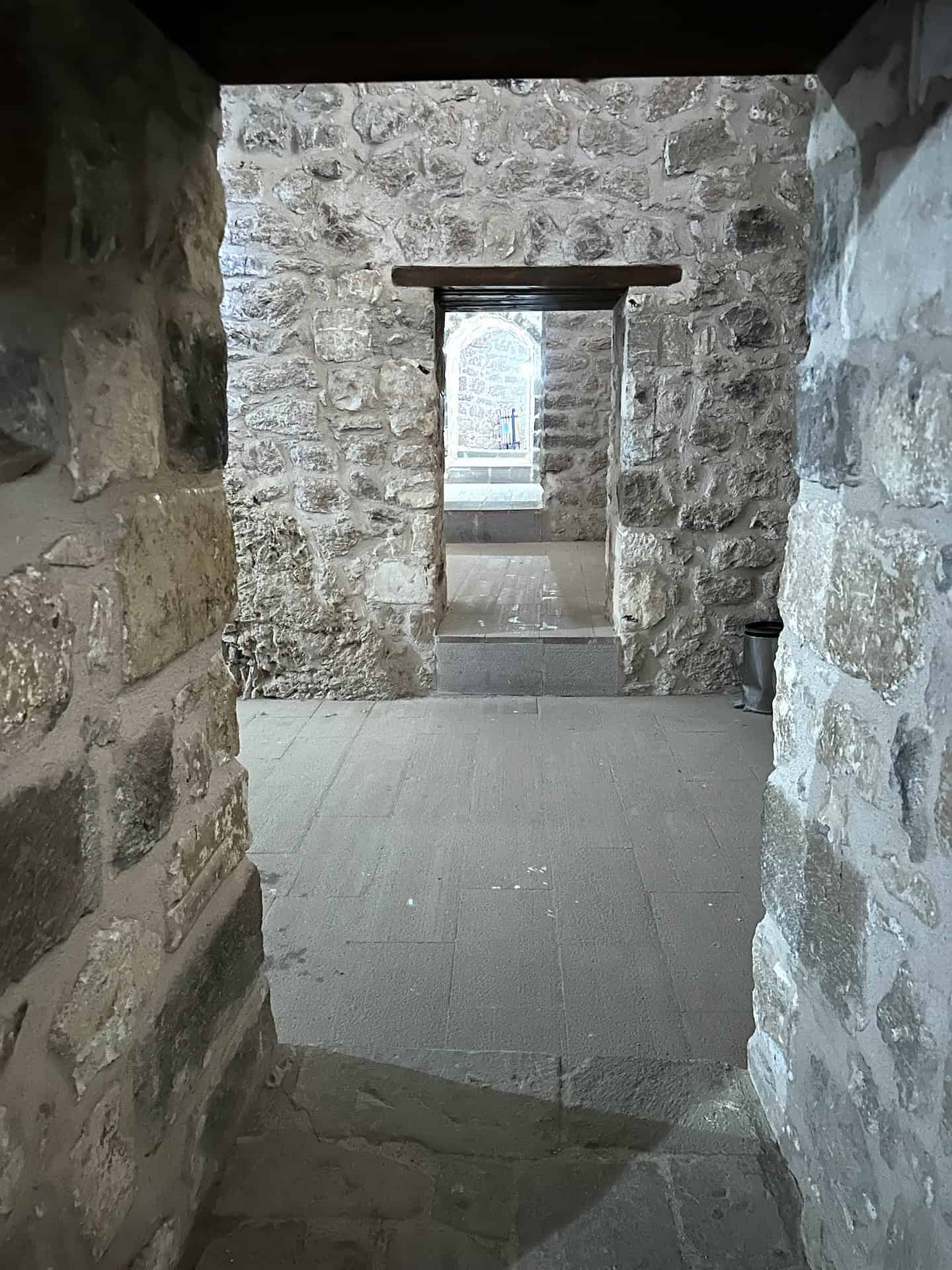 Looking through the doors of the dungeon of the Ishak Pasha Palace