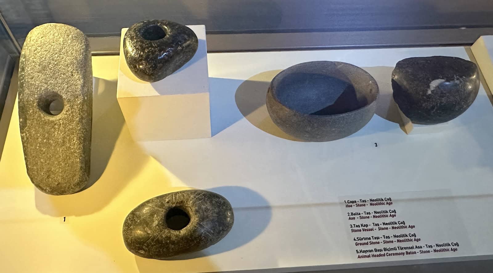 Neolithic Age grinding stones, vessels, and axe head