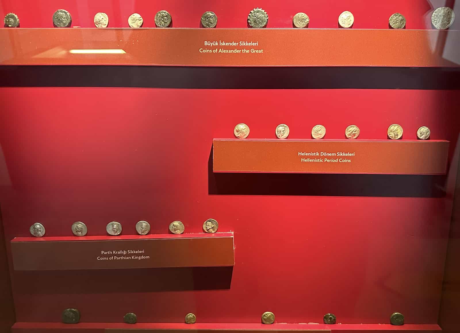 Coins of Alexander the Great (top), Hellenistic period coins (upper middle), Parthian Kingdom coins (lower middle), and Cappadocian coins (bottom) at the Hasankeyf Museum in Turkey