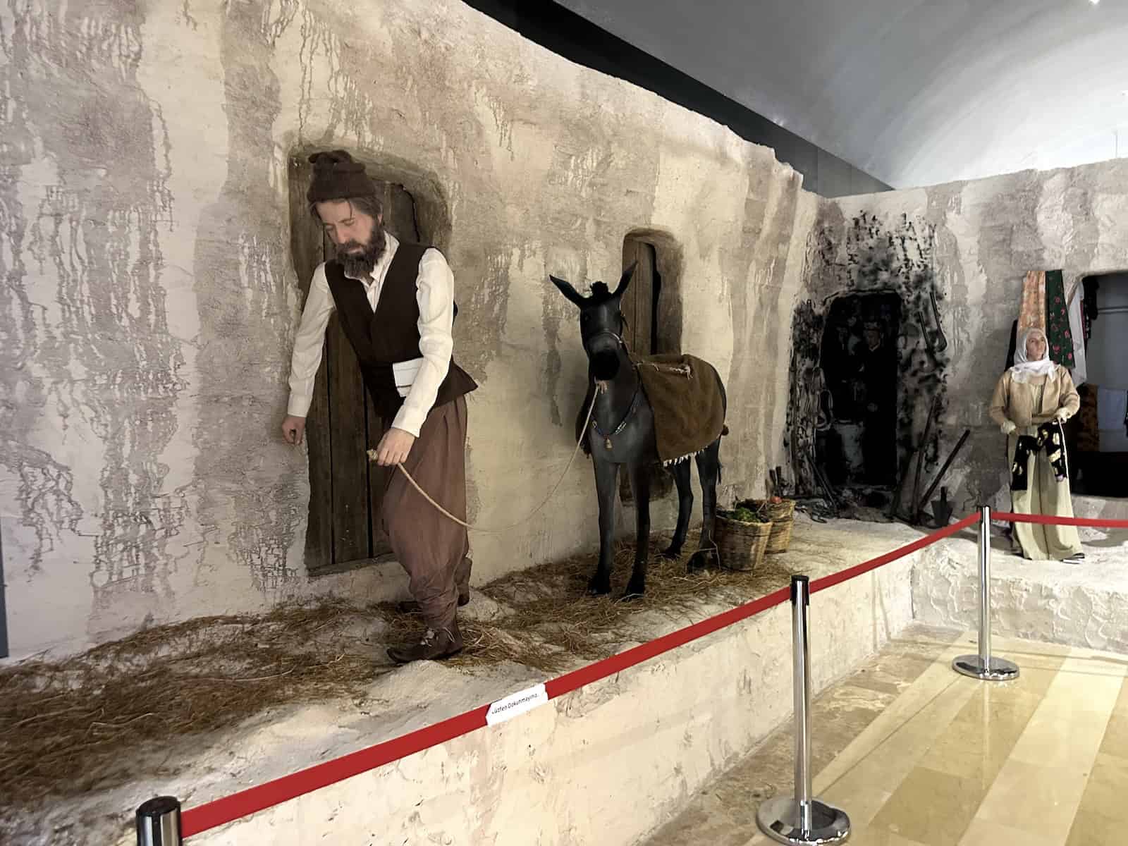 Display of a man with a donkey