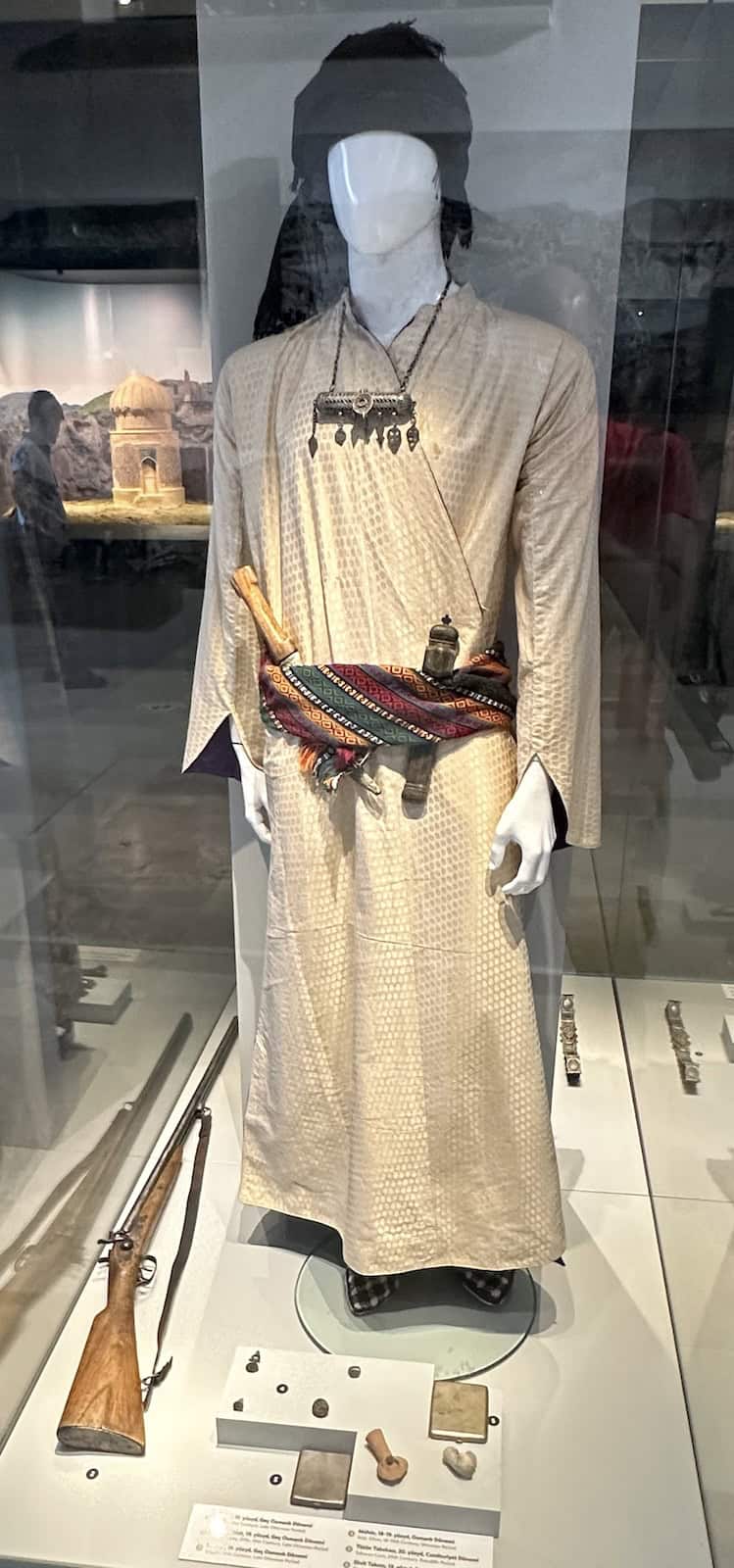 Late Ottoman period caftan, rifle, and accessories; 19th century at the Hasankeyf Museum in Turkey